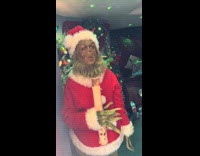 Girl scared by standing grinch