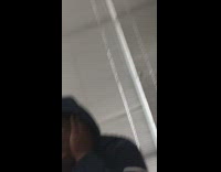 Guy blue hoodie stretching face with hands in class