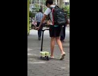 Collab WINY - Man carry matcha drinks with scooter park