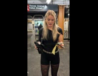 Woman shows alcohol container ticket and outfit