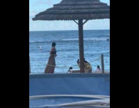 Collab IITW - Woman crop top long skirt poses near beach hut