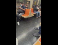 Woman bare foot rest on orange seats subway