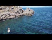 Coast drone shot woman on paddle board