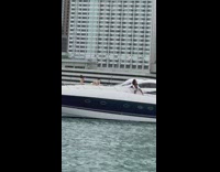 Woman twerks on the deck of the yacht