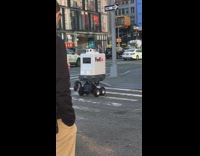 Fedex machine robot drives around sidewalk street