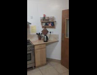 Man throws spatula shoots on utensils crock