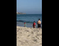 Woman in red bikini with a seaweed skirt at the beach Part 2