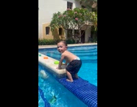 Kid climb throws toys falls in pool