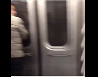 Guy pees near train door 