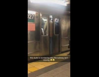 Man holds up train by standing in front of closing doors, doesnt fit on subway 