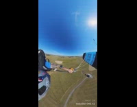 Man skydives and swoops down with smooth landing