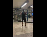 Guy works out arms at train station