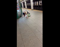 Old man pushups at the subway station