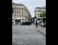 Woman in black shirt walks in the middle of the street