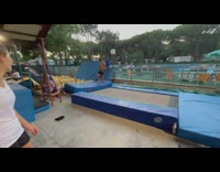 Woman on trampoline scorpions trying to jump into pit