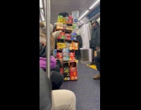 Man on subway sells push cart store