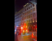 Firefighter climbs on aerial ladder rescues building