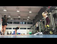 Girl bounces green medicine ball hits face 