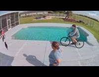 Girl on bike fell in the pool