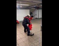 Man dance with skeleton in red dress