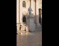 Girl statue brown cathedral church mismatched shoes