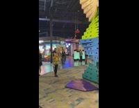 Little girl yellow outfit rainbow climb wall