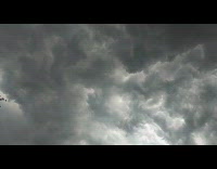 Time lapse grey clouds roll in the sky