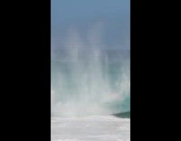 Surfer gets caught under huge wave 