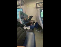 Collab winy - Woman leans on side and does leg workouts on train