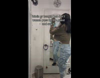 Girl  at door crying upset looks out door