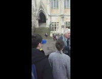 girl black jacket church steps pose