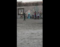 Girls dance crazy in front of cactus wall mural 