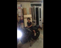 Collab PubityPets - Young boy sit on motorcycle rev engine