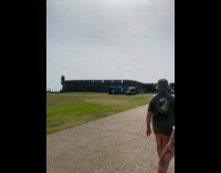 Woman poses on the old building ledge