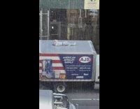 Guy laying on roof of parked truck