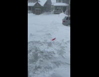 Guy walk outside thick snowstorm Colorado neighborhood