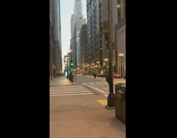 Woman black coat middle street green stoplight