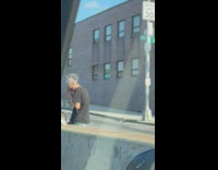 Homeless man along the street in the morning