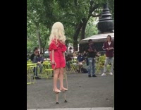 Woman blonde wig stand on stilts park
