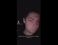 Guy in club in front of dj with airpod in ear