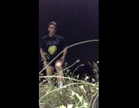 Guy tracks mouse in weeds at night and it jumps at him