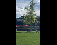 Man jogs shirtless and films at park