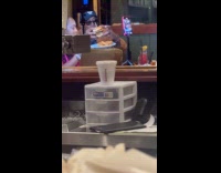 Couple films their food inside the restaurant