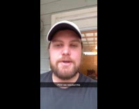 Two guys outside admiring rain 