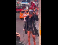 Woman horns and chain dance on street
