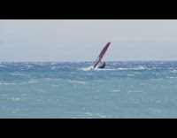Guy windsurfs and gets knocked out by inflatable