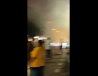 Collab WINY - Box with flames while people watch fireworks