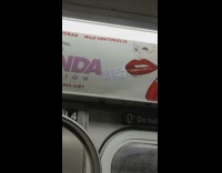 Funny sign stuck to subway ad 