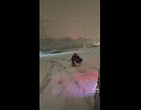 Person on Sleigh Gets Pulled by Car