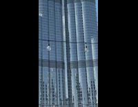 Man with both feet on the railings Burj Khalifa